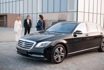 group-business-people-talking-go-from-modern-building-airport-some-office-luxury-taxi-parking-lot-sunset-business-partners-are-going-leave-by-luxury-car group-business-people-talking-go-from-modern-building-airport-some-office-luxury-taxi-parking-lot-sunset-business-partners-are-going-leave-by-luxury-car
